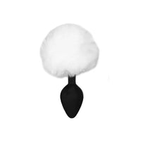 Soft white bunny tail plug with plush fur, designed in sleek black and white for playful intimacy and discreet enjoyment.