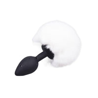 A fluffy, white bunny tail with plush fur adds a whimsical flair. The butt plug bunny arrives discreetly and enhances adult intimacy with its classic black and white tones.