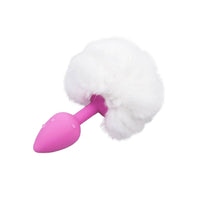 Indulge in the plush softness of the pink, white tail as its tapered, pink plug fits snugly, igniting your fantasy. bunny tail toys enhance adult play!