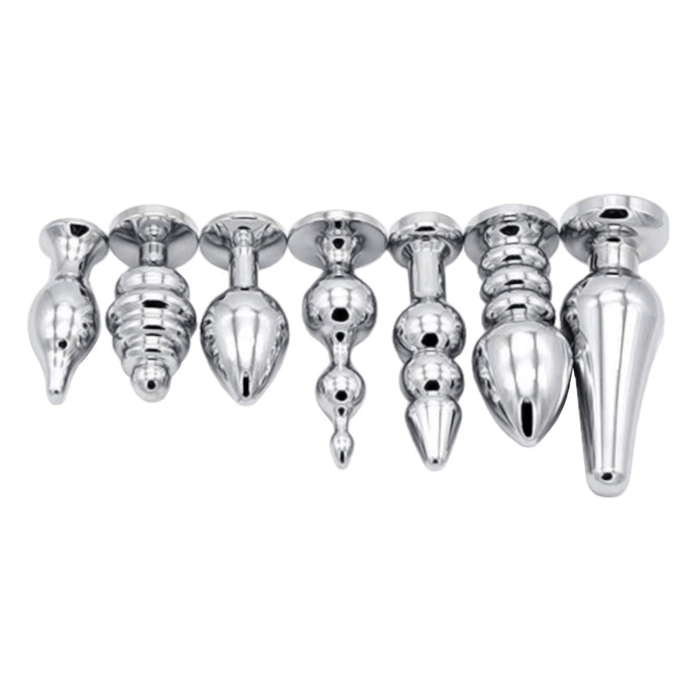 An image showcases a solid, stainless steel vibrating plug, designed for anus play. The metal plug offers a powerful silver e-stim set experience.
