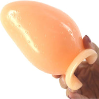 The huge sex toy, made from durable PVC, features a suction cup, classic dilator design, and is available in purple for versatile use.