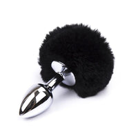 The black large sex toy rabbit with a tail fits comfortably inside, adding to the metal, black, white, bunny ear look.