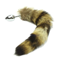 Feel sexy with this sleek metal plug swaying between your legs, enhanced by the brown, black fur of raccoon sex toys, radiating confidence.