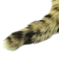 The brown, fur tail with khaki and black tones, a sleek metal plug, and soft raccoon fur adds excitement to your animal play. sex toys raccoon