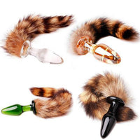 Discreetly packaged, this glass plug features black, clear, green, and golden colors. Enjoy the raccoon sex toys with brown, fluffy ear fibers.