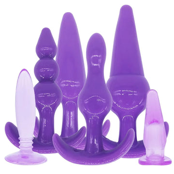 Enhance your kink play and explore beads, dildos, and vibrators with this silicone butt training set. The pink or purple colors, along with the flared bases, make stretching comfortable and safe.