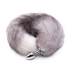 Feel the seductive swish of this butt fox tail, with its pulling, fluffy, gray, synthetic fur. The stainless steel sex toy feels amazing and fake.